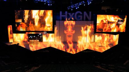 Image of the set rendering at Hexagon's HxGN LIVE! event being transformed into one jumbo display using projection mapping.