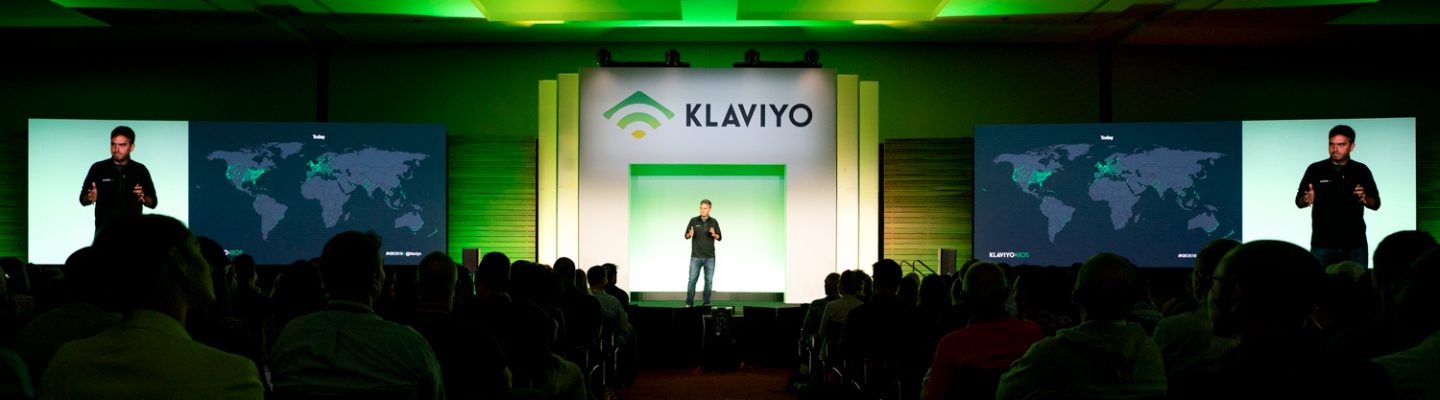 A speaker talks to the audience at Klaviyo:BOS industry conference