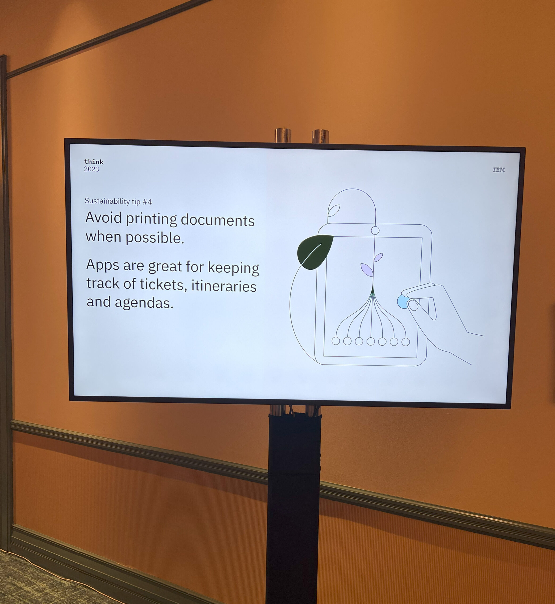 Monitor displays notes about sustainability and reducing waste at IBM Think 